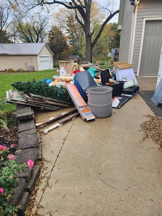 Dumpster being loaded with debris for Residential Dumpster Rental in Omaha